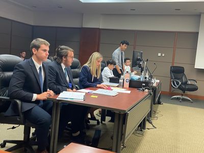 Students participating in a mock trial at the courthouse.