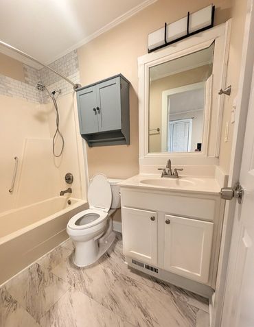Demo existing bathroom, replace fixtures, cabs, ducting, tile floor,l + plumbing and electrical