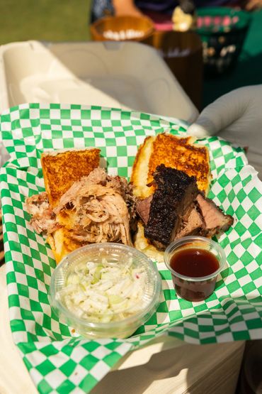 Barbecue sandwich with coleslaw and sauce.