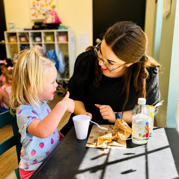 teacher with child in preschool