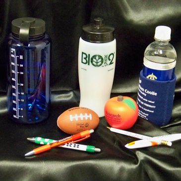 Customizeable promotional items including water bottles, stress balls, pens, and koozies.