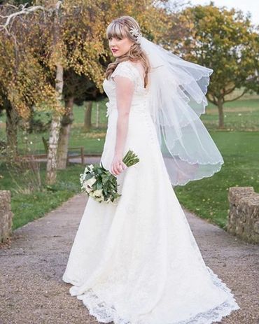 A stunning creation by Nicola Anne.  Classic corded lace over satin. Romantic & unforgettable