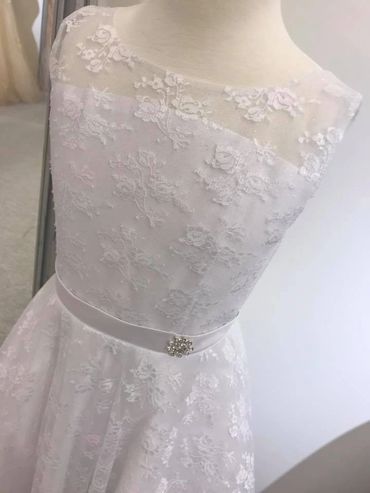 Lace holy communion dress with sheer neckline. Can be made with neckline filled in