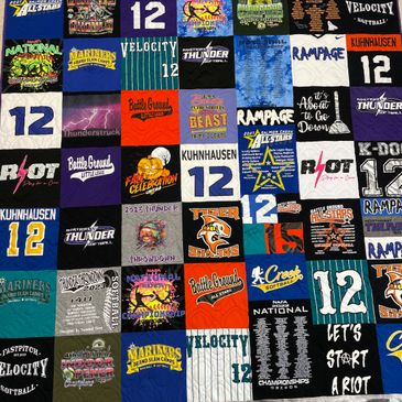 Queen size t-shirt quilt collage made from softball jerseys and sweatshirts.