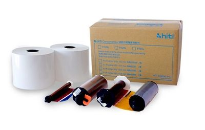 Printer ribbon and paper rolls with a cardboard box on white background.