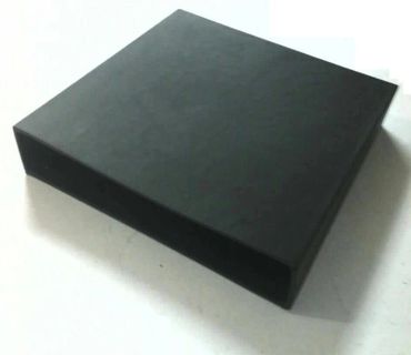 A plain black rectangular box with an open side on a white surface.