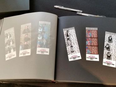 Photo booth strips from Zena's 2015 birthday celebration in an album.