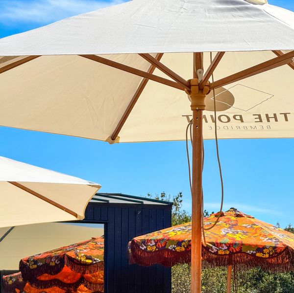 Outdoor umbrellas providing shade on a sunny day.