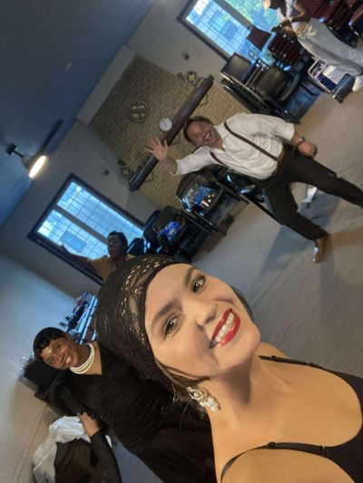 Group of friends smiling and posing indoors.
