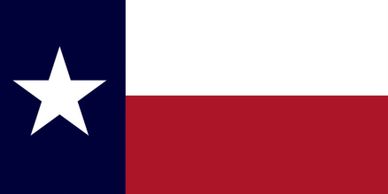 The flag of Texas with a lone white star on a blue vertical stripe, and horizontal white and red stripes.