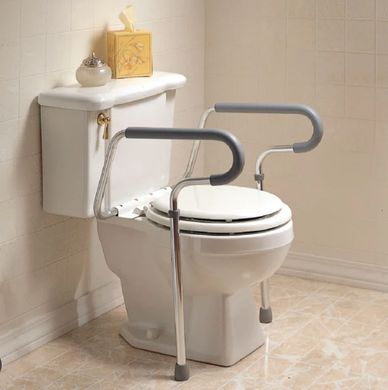 Toilet with support rails for increased safety and accessibility in the bathroom.