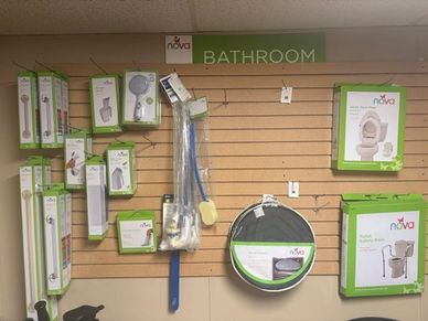 Bathroom safety products displayed on a wall in a store.