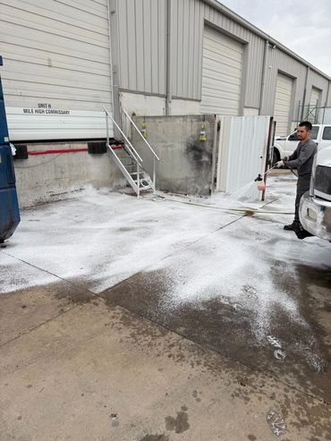 Commercial pressure washing of a warehouse loading dock
