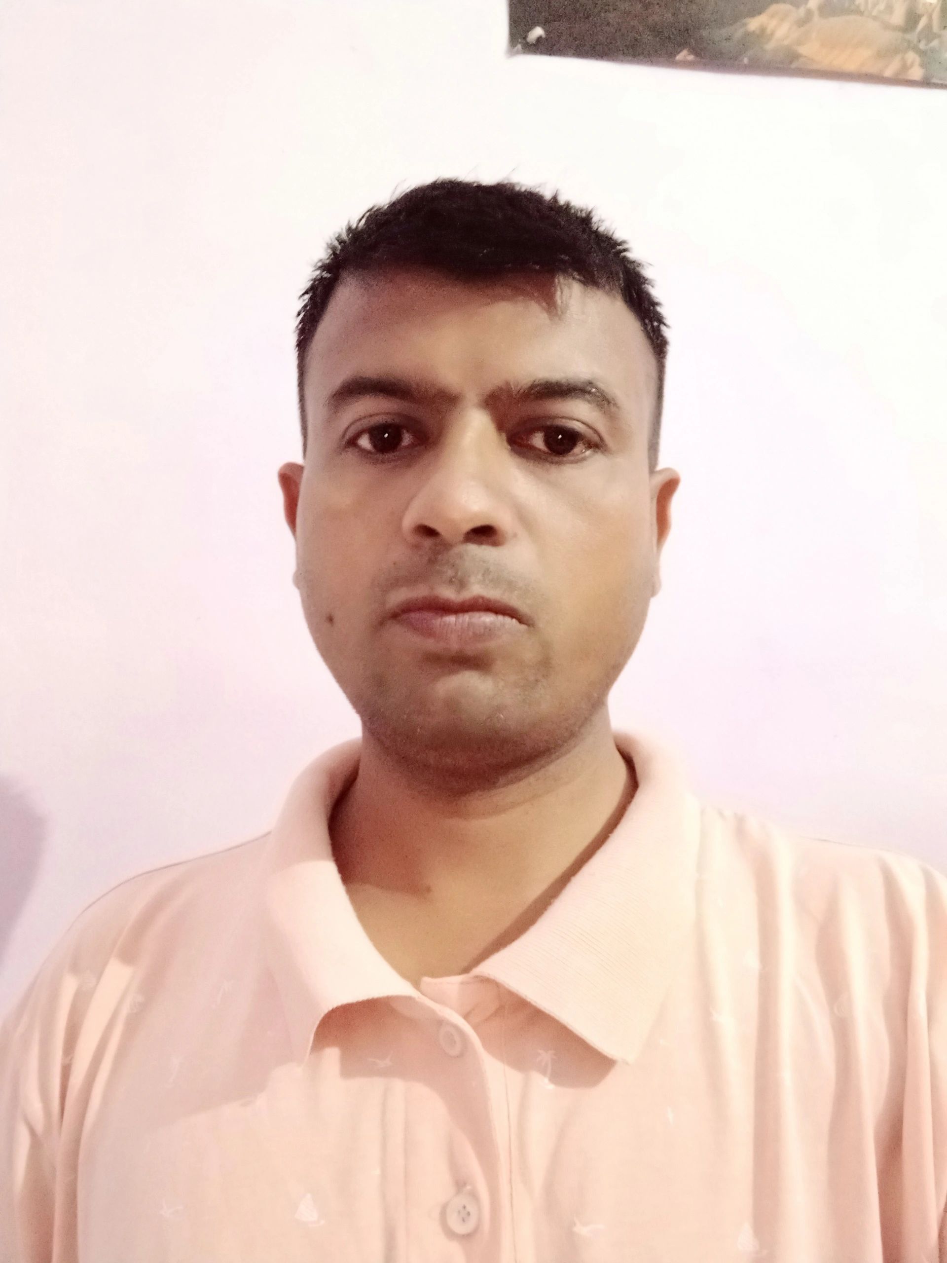 Nehemiah Dhariwal is in his room, wearing a T-shirt.