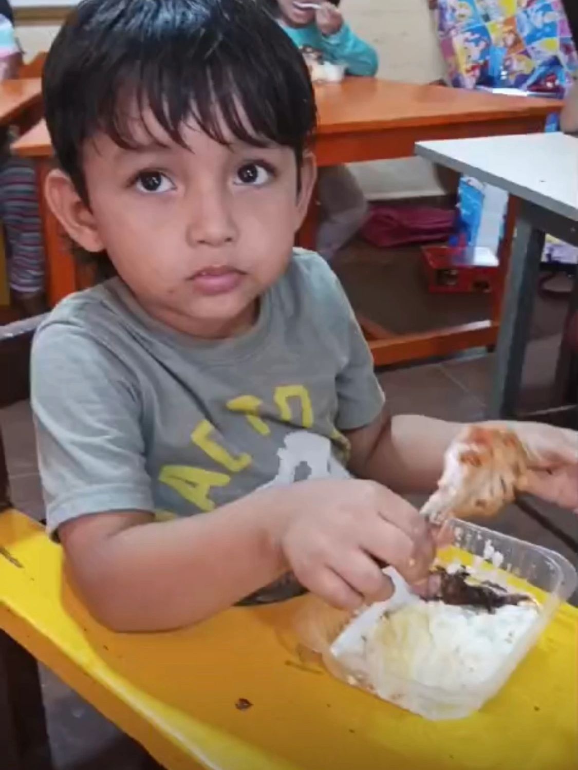 A child eating the meat