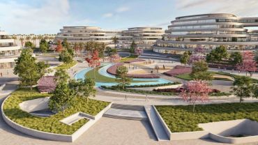 Modern architectural complex with landscaped gardens and water features.