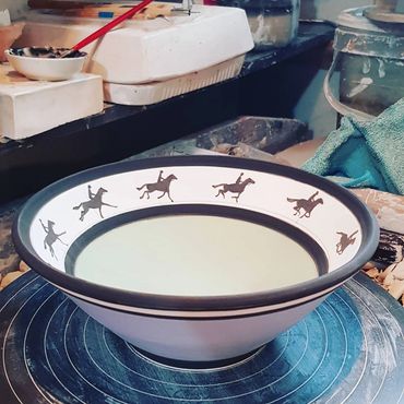 Bowl with horses galloping around the rim