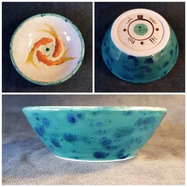 Three goldfish in a bowl