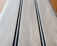 Stained wood, with a powder glaze. Finished ultra smooth with Axalta brand clear coat.