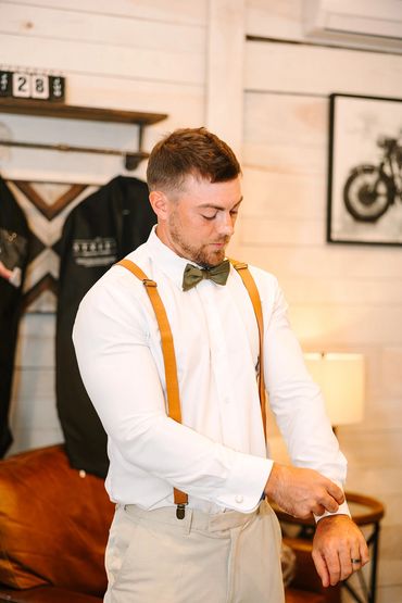 Groom getting ready moment