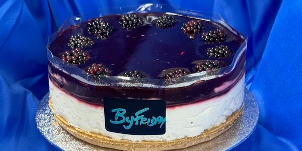 Blackberry cheesecake with a glossy top layer.