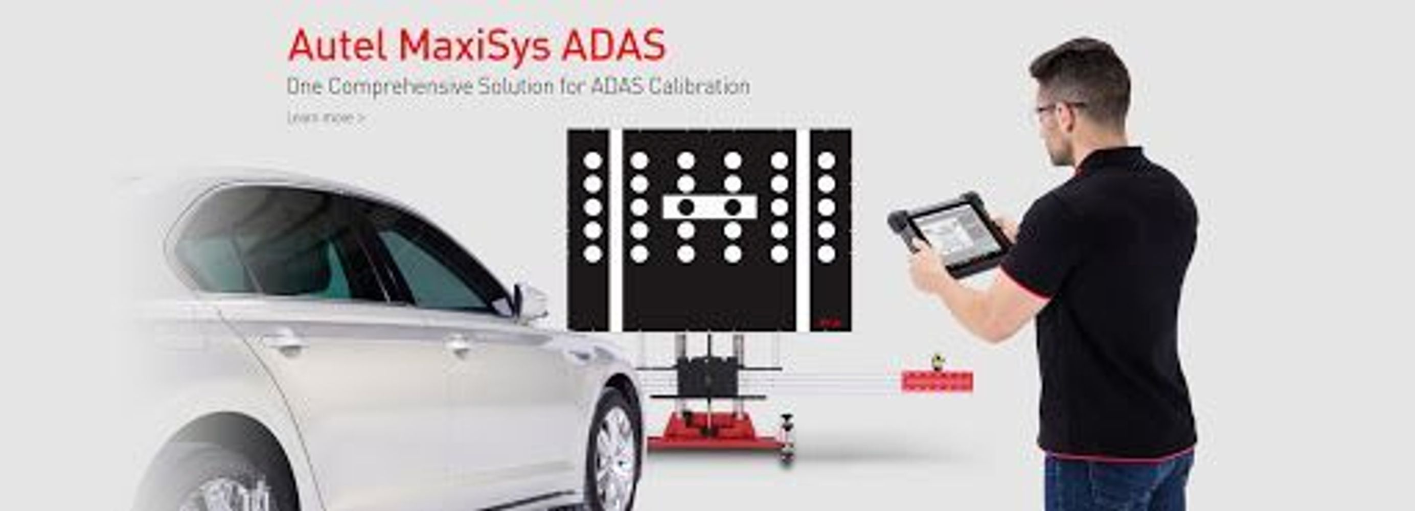 Man calibrating a car using Autel MaxiSys ADAS device.