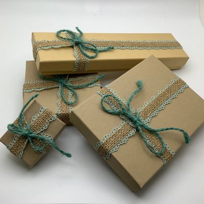 Beautiful handcrafted reusable craft boxes tied with burlap and sage ribbon.