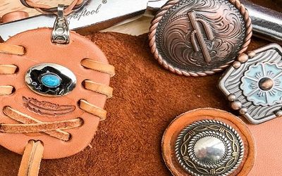 Leather, conchos, and leather crafting tools at Artisan Jewelry of the West shop.