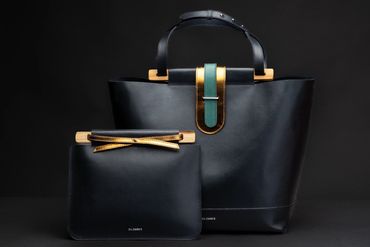 Luxury black leather tote and clutch with gold accents and wood details by Dcember