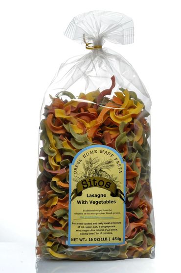 Bag of colorful vegetable lasagne pasta photographed against a white background for e-commerce