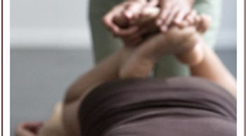 A person giving a leg massage