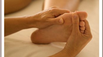 A person giving a foot massage