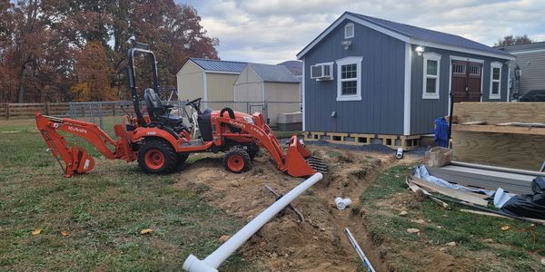 Our Mini Backhoe Kubota BX  For Getting In Small Spaces Doing Gutter Drains