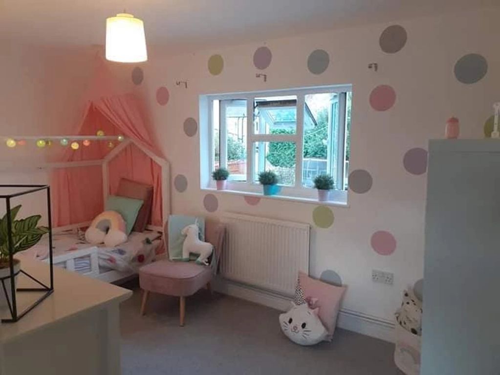 Childrens Bedroom feature wall in Crown paints various pastel shades