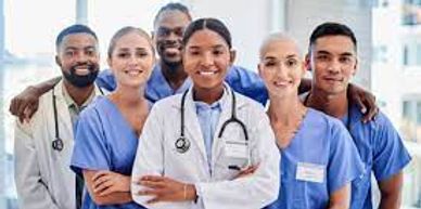 Picture containing a group of doctors, nurses, and health care staff.