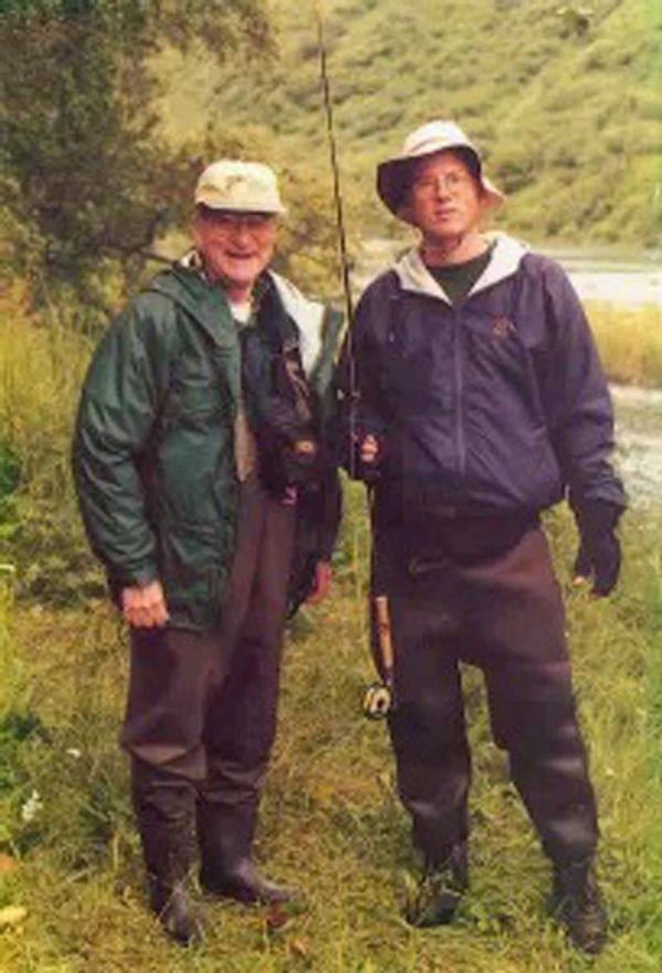Drs. Norman and Stephen Anderson fly fishing in Alsaska