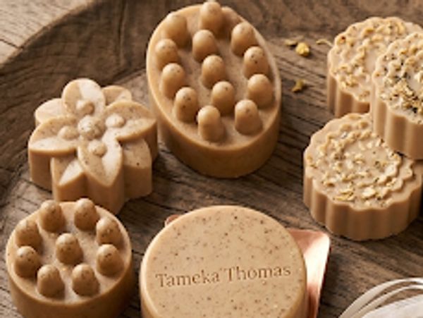 Artisan soaps with textured designs and natural ingredients.