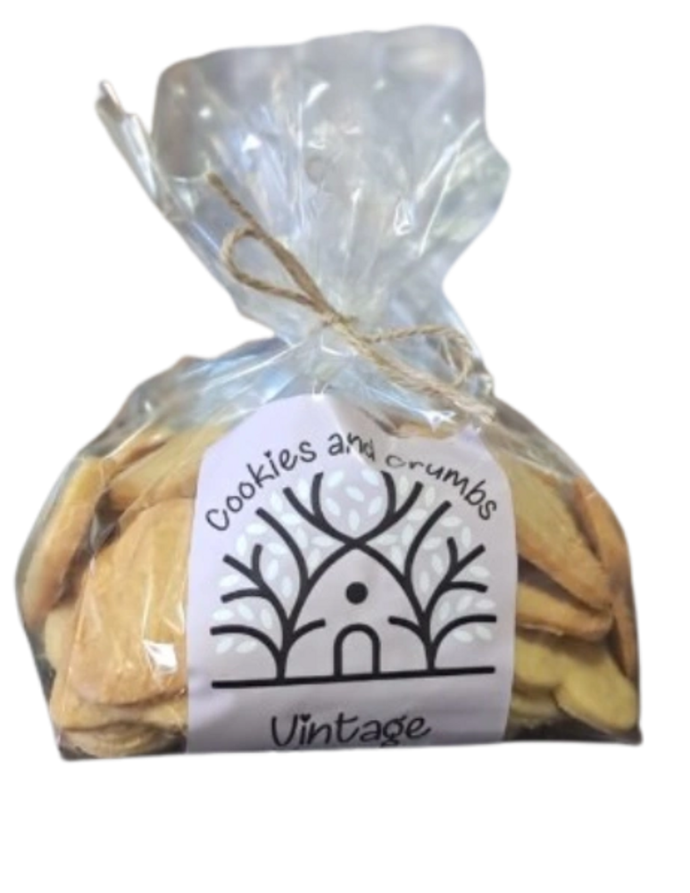 Clear bag of cookies tied with string and vintage label.