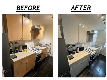 Kitchen makeover with new white cabinets and marble backsplash for a modern look.