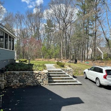 Stone steps and fieldstone retaining walls, asphalt driveway, landscape design