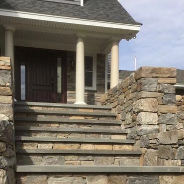 Stone retaining walls and steps, bluestone walkway and steps