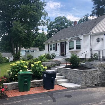 Granite steps, red brick walkway and stone walls