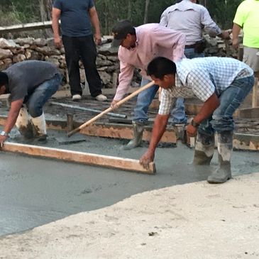Pouring concrete for house patio. 
