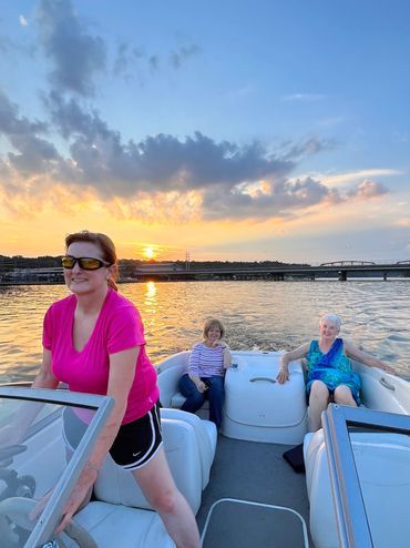 People enjoying sunset boat ride.