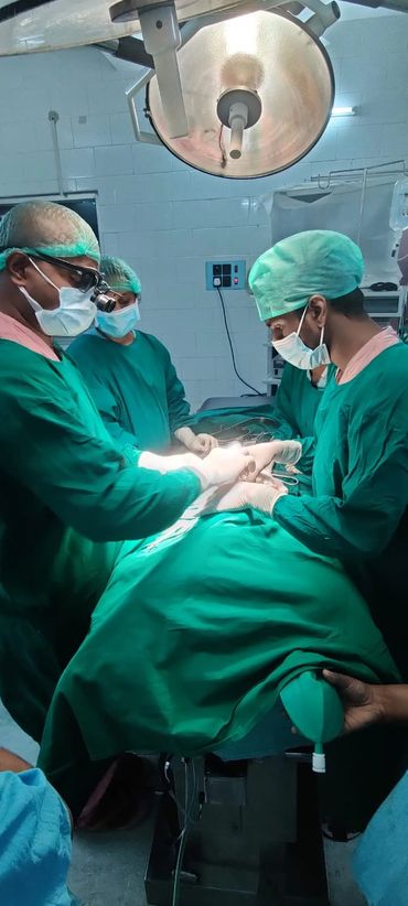 Doctors doing major renal surgery on a 5 month old infant.