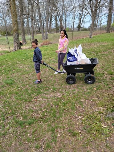 Wheeling the chicken feed to the hens