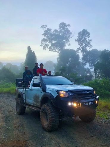 Group of people on a wildlife safari at Deramakot