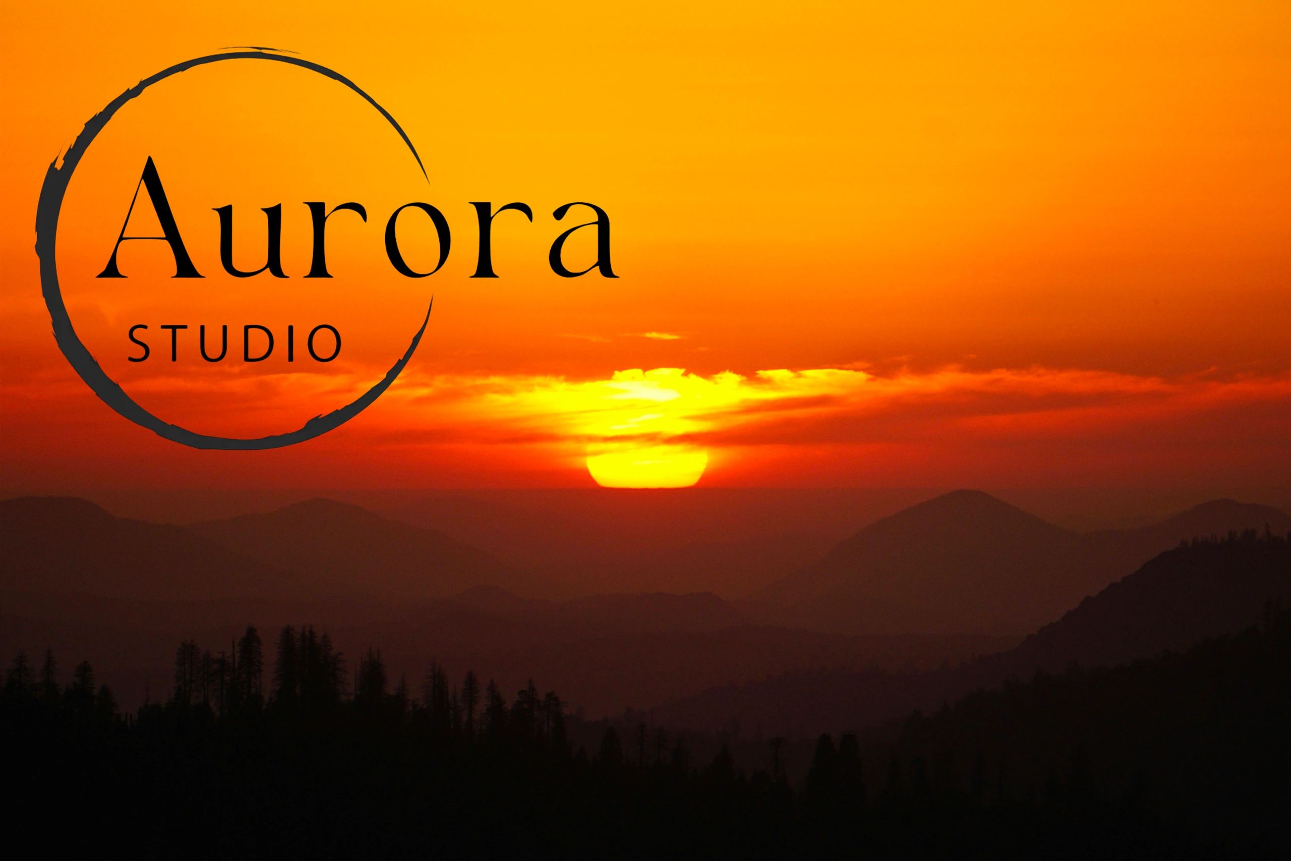 Sunset over mountains with Aurora Studio logo.