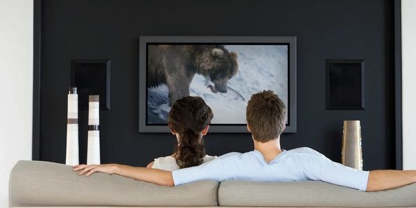 Couple watching direct response tv