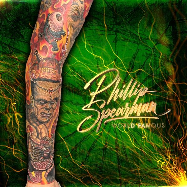 Vibrant full-arm tattoo with intense faces and fiery background.